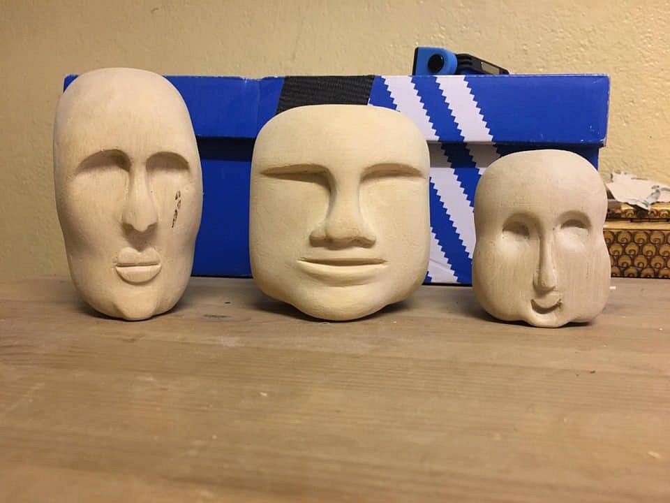 3 wooden heads