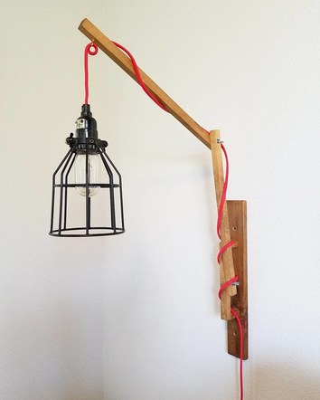 Adjustable arm wall sconce