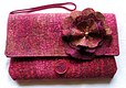 Silk clutch bag with silk flower, both heavily stitched.