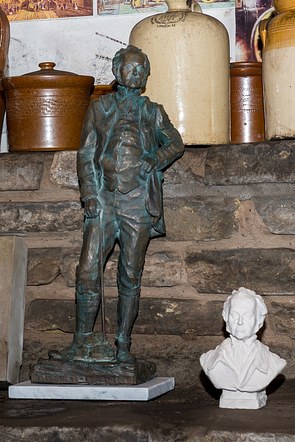 Joseph Williamson in the tunnels with a plaster bust alongside.