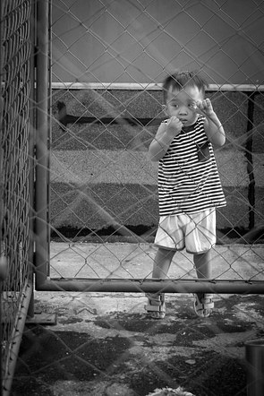 Kid at the fence.